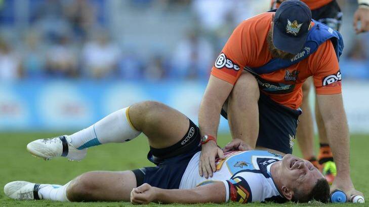 Greg Bird of the Titans screams in pain after injuring his shoulder against the Tigers.