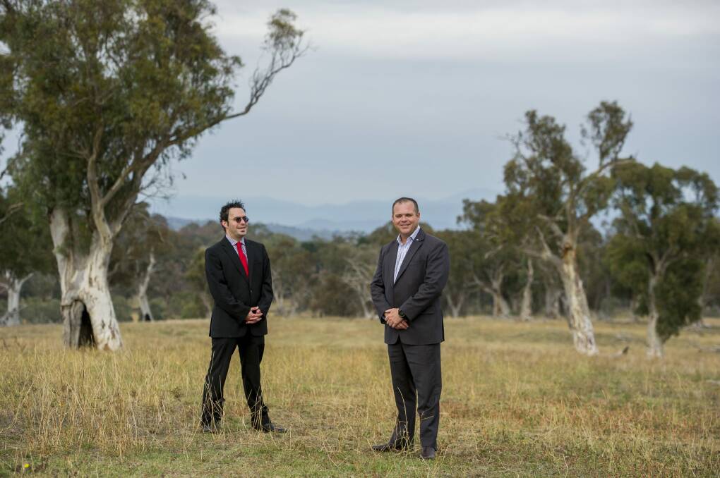 ACT Shelter boss Travis Gilbert and CSIRO general manager for business and infrastructure services Mark Wallis at the CSIRO Ginninderra Field Station site. Photo: Jay Cronan