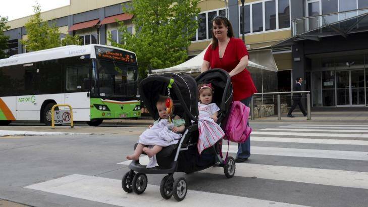Heather Tricker with  daughters Portia, front and Charlotte, says she would would support a Canberra-wide network. Photo: Graham Tidy