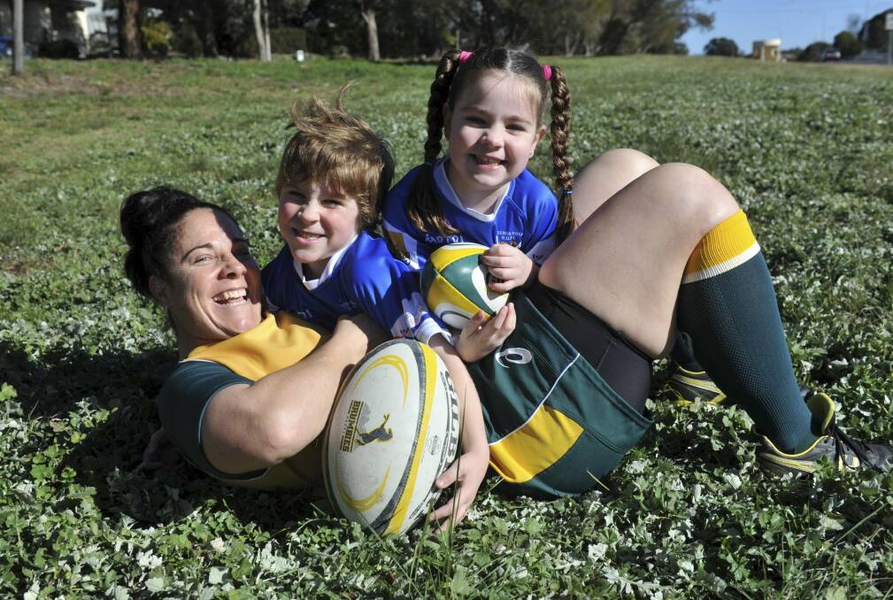 Louise Burrows plays with her two children, Fletcher, 6 and Georgie, 5. Photo: Graham Tidy