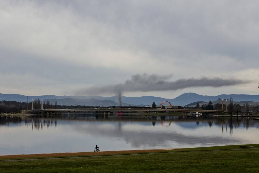 The fire at the Canberra National Zoo and Aquarium on Sunday sent a plume of smoke into the sky.
 Photo: Jamila Toderas
