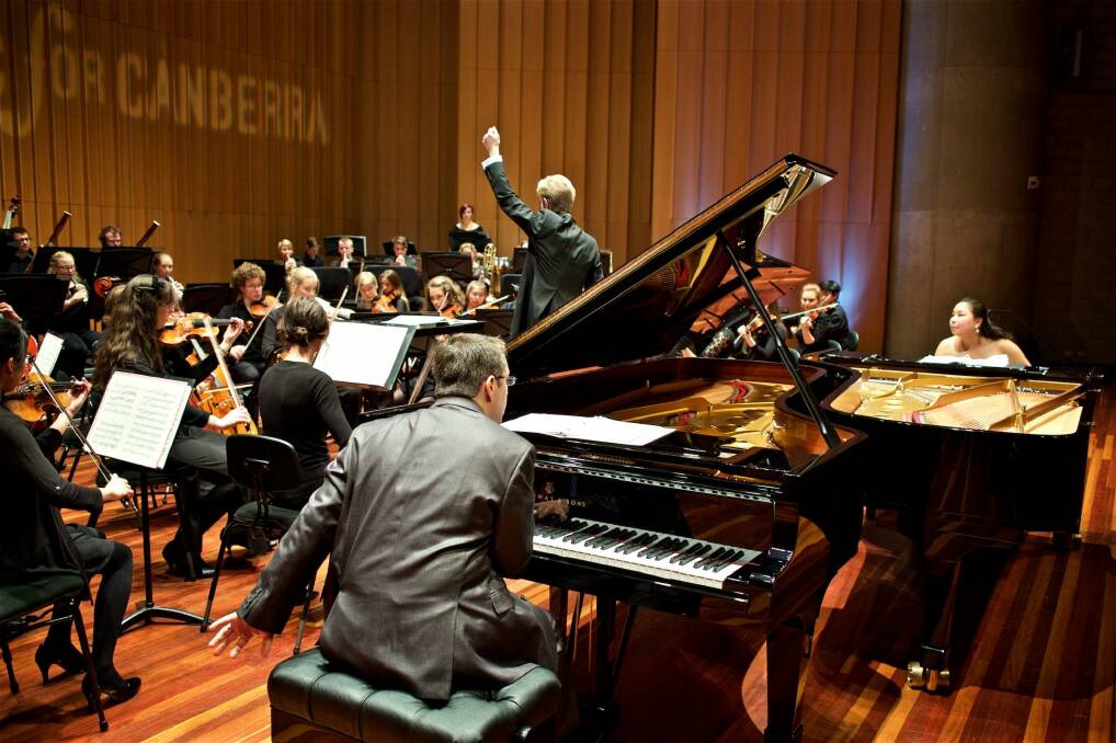 Pianists Dr Edward Neeman and Dr Stefanie Neeman and the Canberra Youth Orchestra conducted by Leonard Weiss. Photo: William Hall