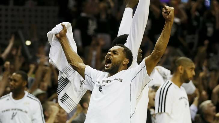 San Antonio Spurs' Patty Mills celebrates during last year's NBA championship series against Miami. Photo: Reuters