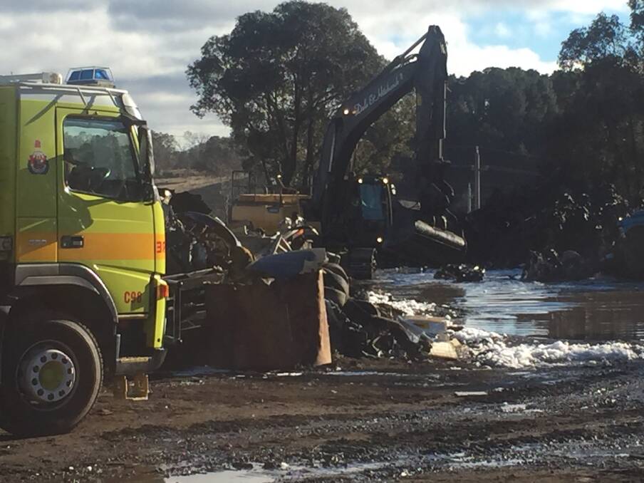 Firefighters work to extinguish a fire at the GRI scrap metal yard in Beard on Monday morning. Photo: Supplied