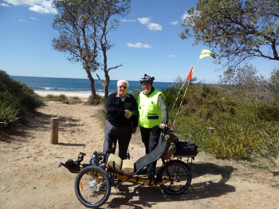 We did it: Garry Stroud and son Shane at the finishing point at Moruya. Photo: Supplied