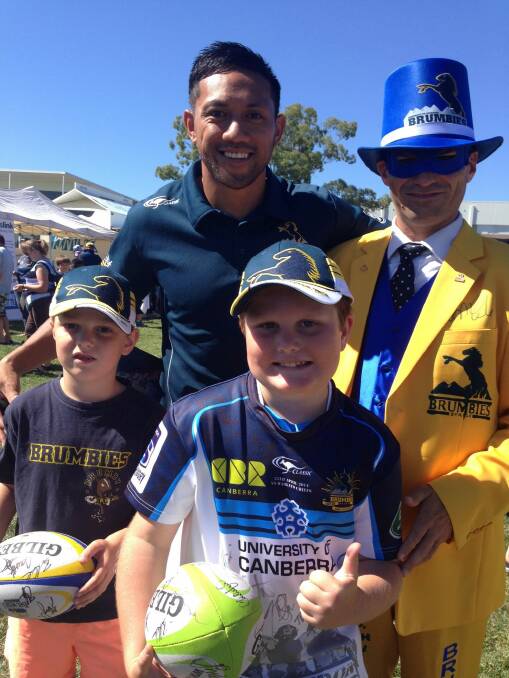Brumbies player Christian Lealiifano with Brumbies Man aka Trevor Hancock and Brumbies Boy (middle) aka Joshua Hancock and younger brother Ben Hancock.  The family say Christian is a special player on and off the field. Photo: Supplied