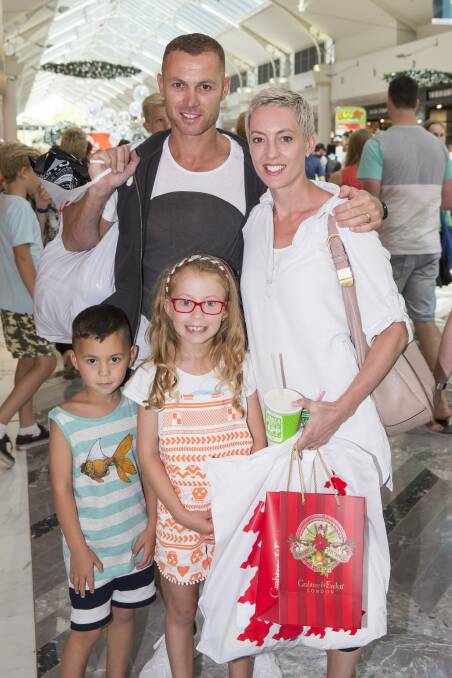 Danny and Loretta Hately and their children Jacob, 4, and Chelsea , 6, bought Sheridan linen and Calvin Klein underwear. Photo: Matt Bedford