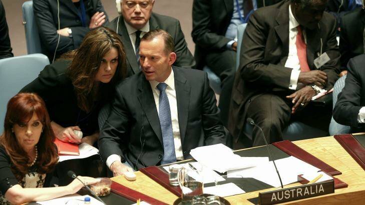 Confidant: Tony Abbott speaks with his chief of staff, Peta Credlin, at a UN Security Council meeting in New York last month. Photo: Alex Ellinghausen