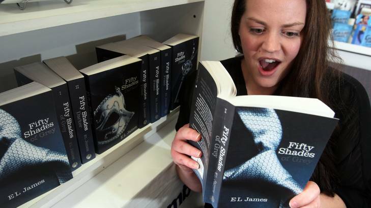 Michaelie Clark from Warrnambool Books holding Fifty Shades of Grey. The shop is having a ladies night next week at the Last Coach to talk about the book. Photo: Leanne Pickett