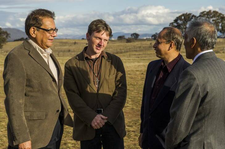 Canberra Muslim Community's Tanveer Khan, Nazre Sobhan, and Borhan Ahmed, talk with Gungahlin Uniting Church Minister Rev. Mark Faulkner, who is expressing support for the Muslim Community's intention to build a mosque on Valley Avenue in Gungahlin. Photo: Rohan Thomson