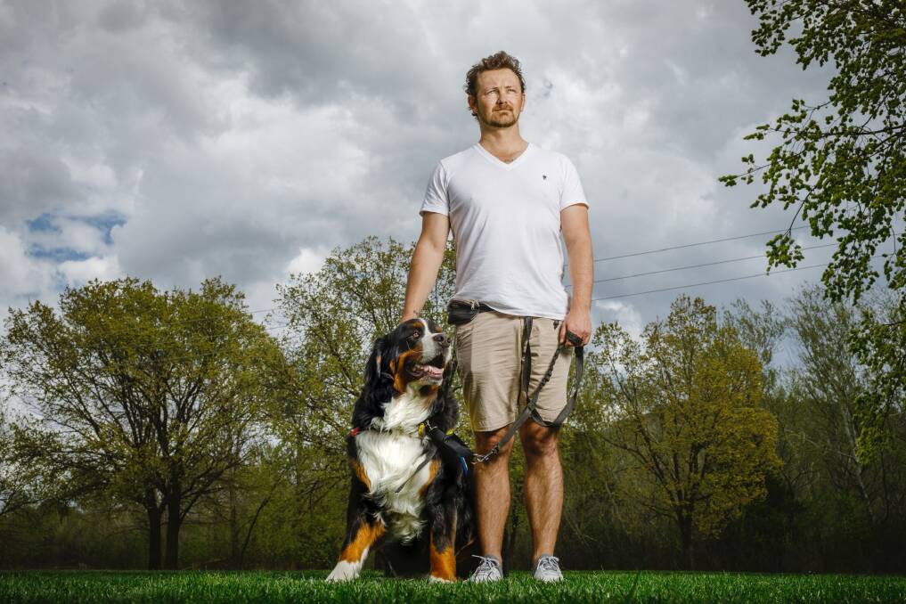 Damian Power and his Bernese Mountain Dog Stirling, who is a Mind Dog Australia service dog.  Photo: Sitthixay Ditthavong