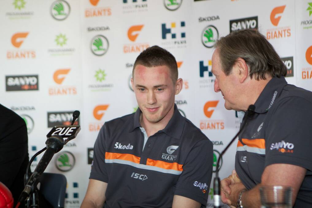 Big move: Tom Scully at the announcement of his switch to GWS with Kevin Sheedy in 2011. Photo: Brendan Esposito