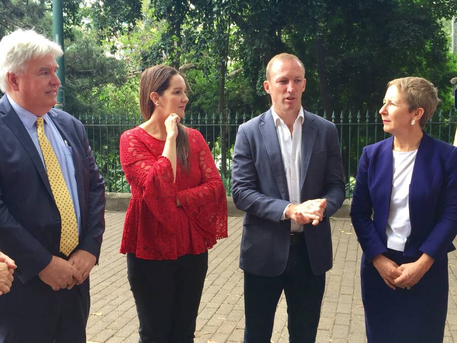 Griffith University domestic violence experts Professor Paul Mazerolle (far left) and Shaan Ross-Smith (middle left) with advocate Darren Lockyer (middle right) and Minister Di Farmer (far right). Photo: Toby Crockford - Fairfax Media