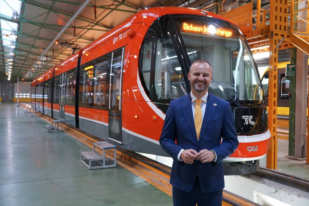 Andrew Barr this week with one of Canberra's new light-rail trains on the production line in Spain. Photo: Karlos Corbella