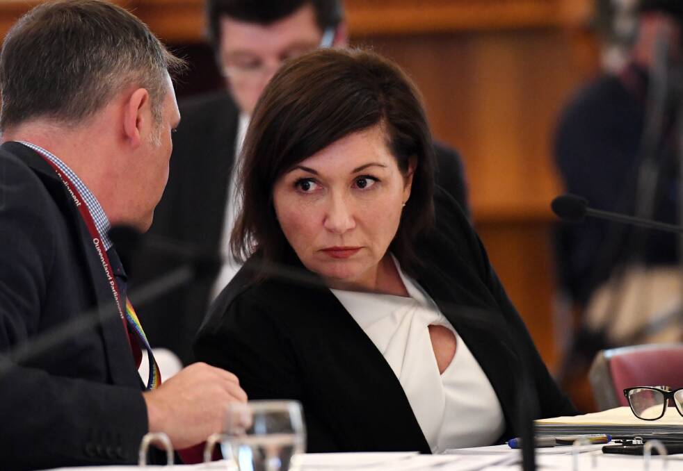 Queensland Minister for Environment, Great Barrier Reef, Science and the Arts, Leeanne Enoch (right) listens to advice from Jamie Merrick, the Director-General of the Department of Environment and Science, during a budget estimates committee hearing at Parliament House in Brisbane.
 Photo: AAP