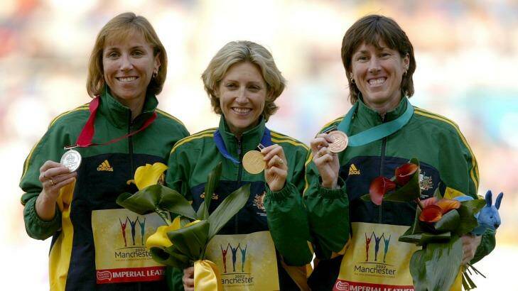 Australia's Krishna Stanton, Kerryn McCann and Jackie Gallagher hold their medals after winning gold, silver and bronze in the Women's Marathon Final in the 2002 Commonwealth Games in Manchester. Photo: Reuters