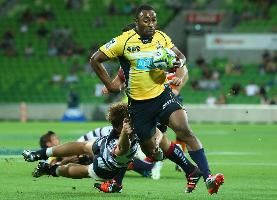 Tevita Kuridrani of the Brumbies breaks through a tackle to score a try. Photo: Quinn Rooney