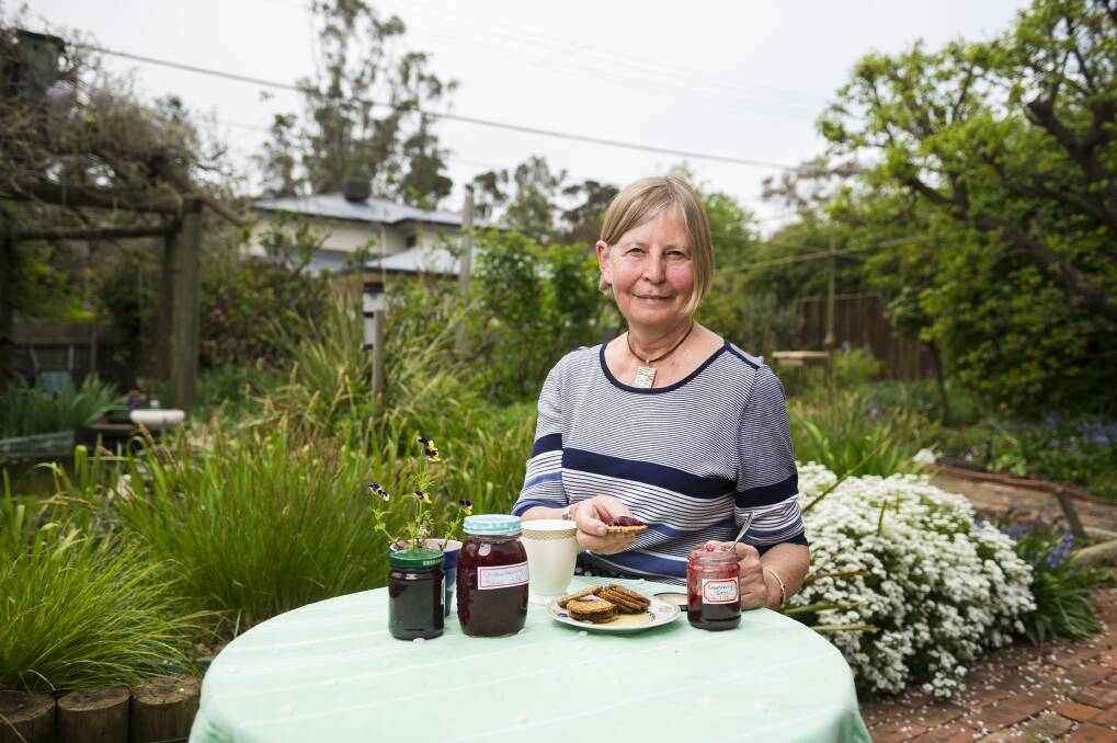 Angelika Dunker enjoying crackers and home made jam in her garden. Photo: Dion Georgopoulos