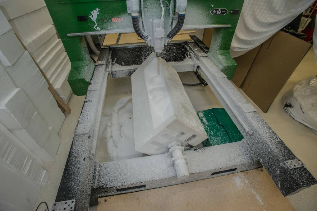 The CNC machine in action, carving a size 18 body from a block of foam. Photo: karleen minney