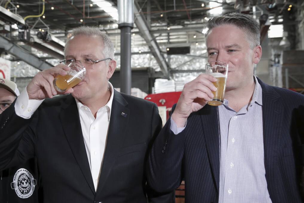 Treasurer Scott Morrison and Finance Minister Mathias Cormann at a Canberra boutique brewery. Photo: Alex Ellinghausen