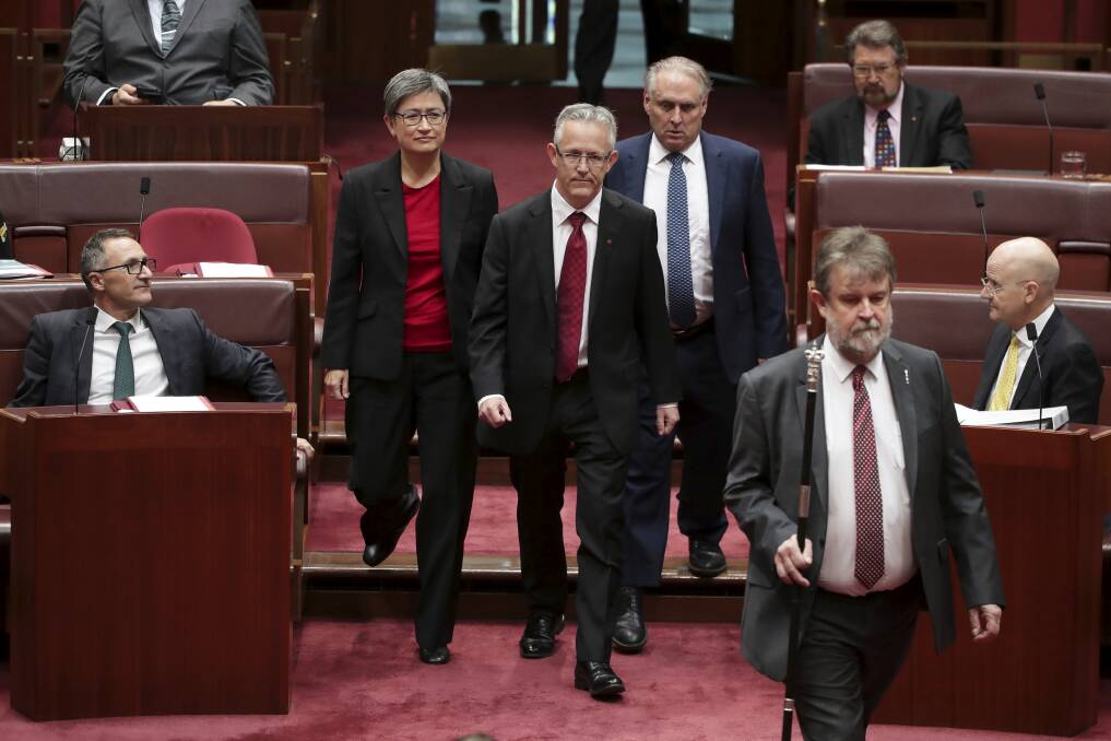 ACT Senator David Smith, flanked by senators Penny Wong and Don Farrell, has been sworn-in. Photo: Alex Ellinghausen