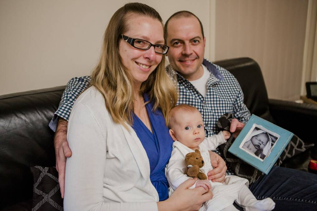 Nicole and Andrew Carroll with their four-month-old daughter, Isobel. Their son, Samuel, died as a result of complications in childbirth. Photo: Jamila Toderas