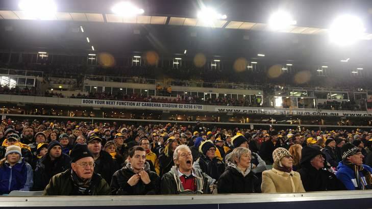 Supporters watch the Brumbies take on the British and Irish Lions at Canberra Stadium. Photo: Melissa Adams