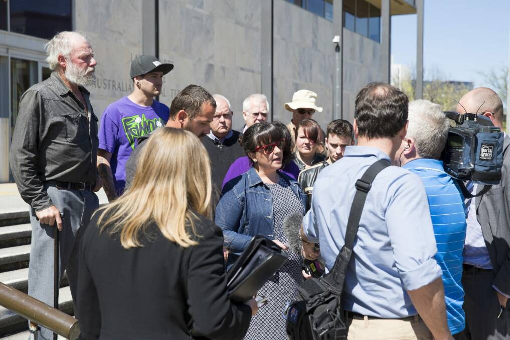 Kathleen Tully, wife of Cameron Tully, reads a statement to the media outside the ACT Supreme Court after her husband was sentenced to 14 years in prison. Photo: Matt Bedford
