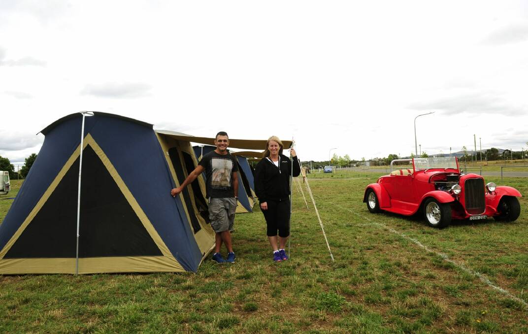 Summernats co-owner Andy Lopez and camping manager Tracy Kennedy at tent city with a 1928 Ford roadster for company. Photo: Melissa Adams