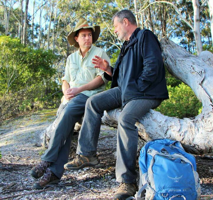 John Blay shares tales of the Bundian Way with Tim near Twofold Bay. Photo: Dave Moore