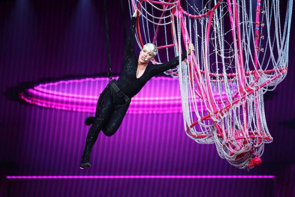 Pink swings from the chandelier in her show in Sydney on Saturday. Photo: AAP