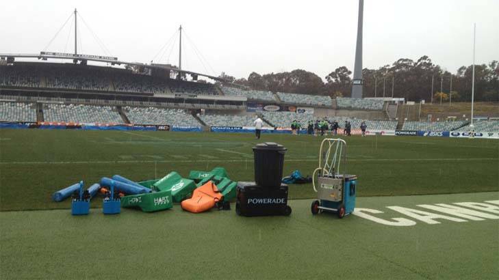 Sleet and snow hit the Canberra Raiders training session at Bruce today. Photo: Lee Gaskin
