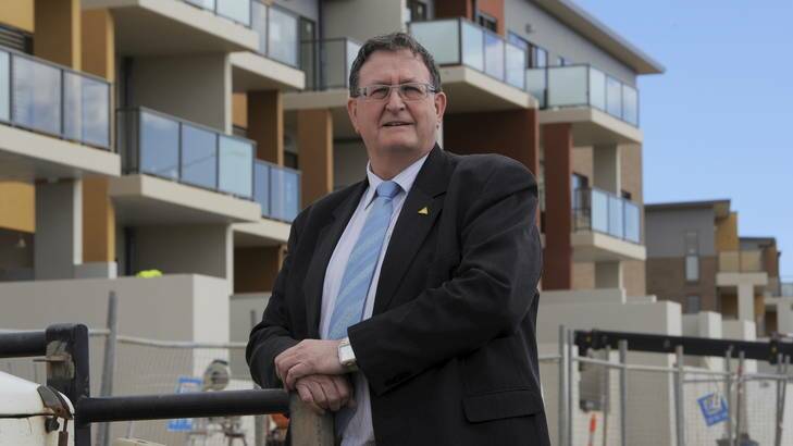 Head of the ACT Economic Development Directorate, David Dawes, in front of a housing development on Flemington Road, Franklin. Photo: Graham Tidy