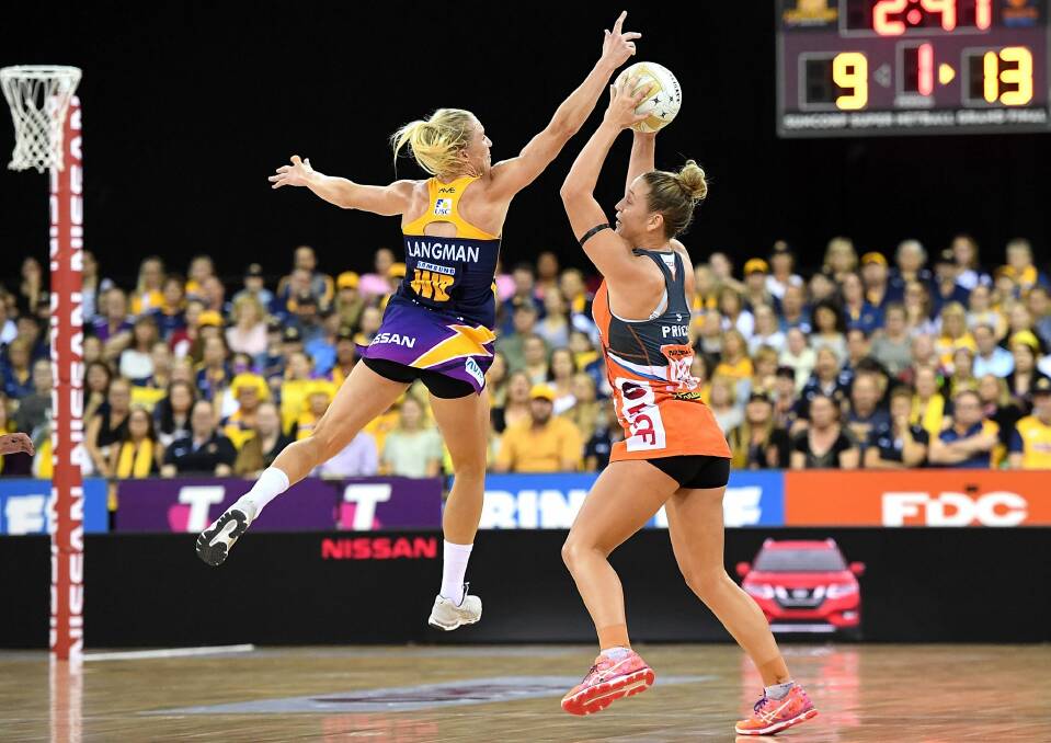 The Giants' Jamie-Lee Price is pressured by the defence of Laura Langman. Photo: Getty Images