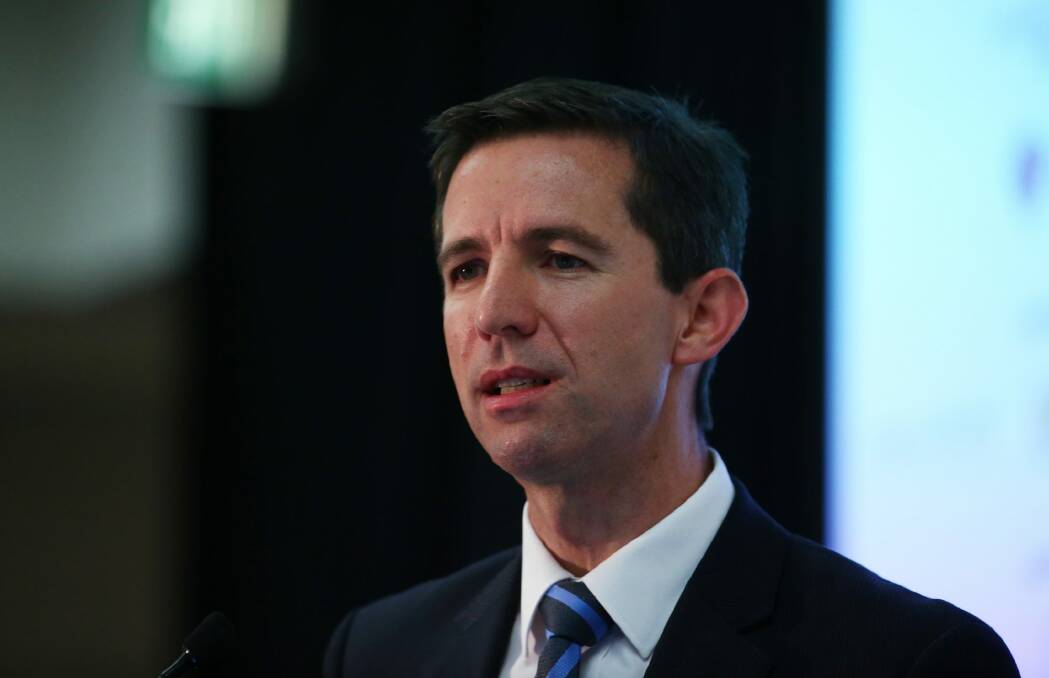 Education Minister Simon Birmingham has outlined plans to collect HECS debt from deceased estates and graduates now based overseas. Photo: Daniel Munoz
