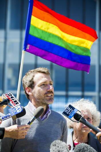 Deputy director of Marriage Equality Australia, Ivan Hinton, speaks to media outside the High Court of Australia after the marriage equality hearing. Photo: Rohan Thomson