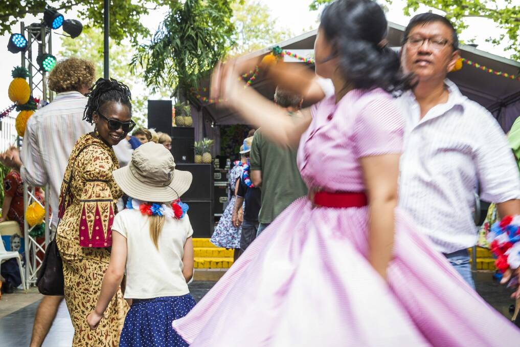 Esther Khakula and Emily Joehnk Escobar, 6, dance together at this year's festival. Photo: Matt Bedford