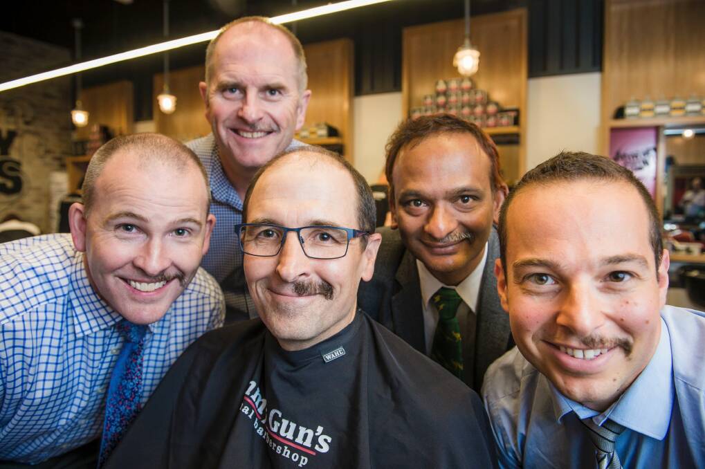 It takes a real man to sport half a mo. Putting their moustaches at half-mast on the last day of Movember at Tommy Gun's barber shop at the Canberra Centre on Thursday were Australian Tax Office workers Adam Shain, Andrew Osborne, John Shepherd, Naru Srini, and Peter Conti. Photo: Sitthixay Ditthavong
