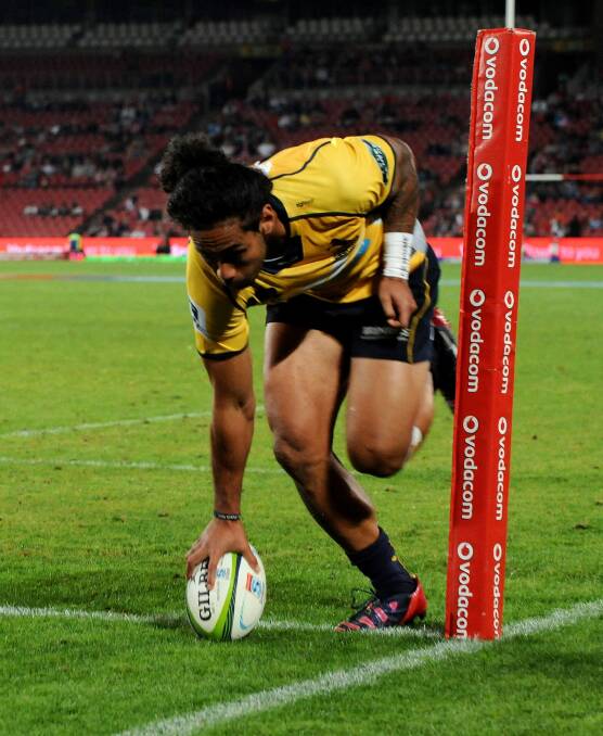 Try time:  Joe Tomane crosses for the Brumbies. Photo: Getty Images