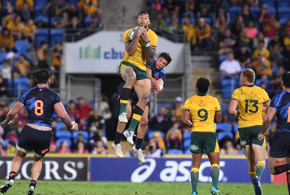 Israel Folau wins a high ball over Bautista Delguy from the Pumas on the Gold Coast.  Photo: AAP