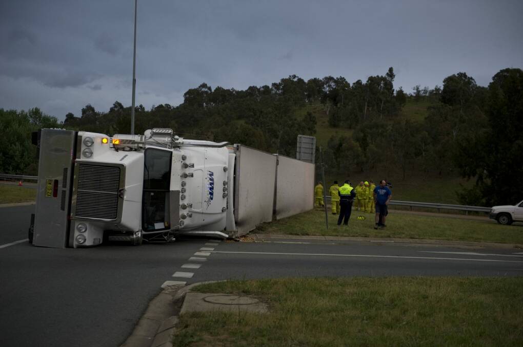 This truck rolled on the ACT's worst roundabout, at Gundaroo Drive and the Barton Highway, in 2013. Photo: Jay Cronan