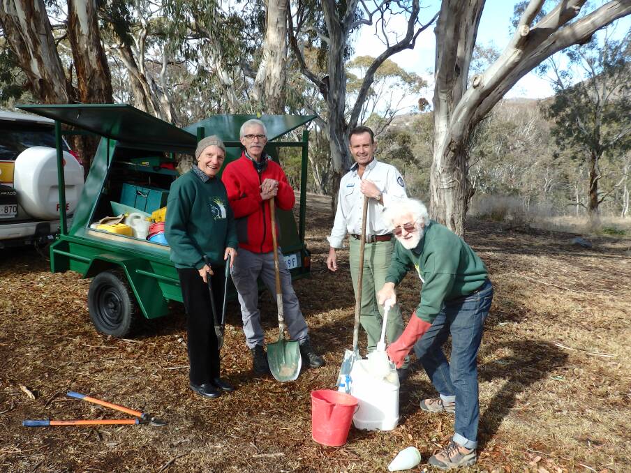 Sonja Lenz, Martin Chalk and Kevin McCue are part of the Gudgenby Bushies volunteers group, pictured with Brett McNamara, ACT Parks and Conservation manager Namadgi National Park. Photo: Supplied