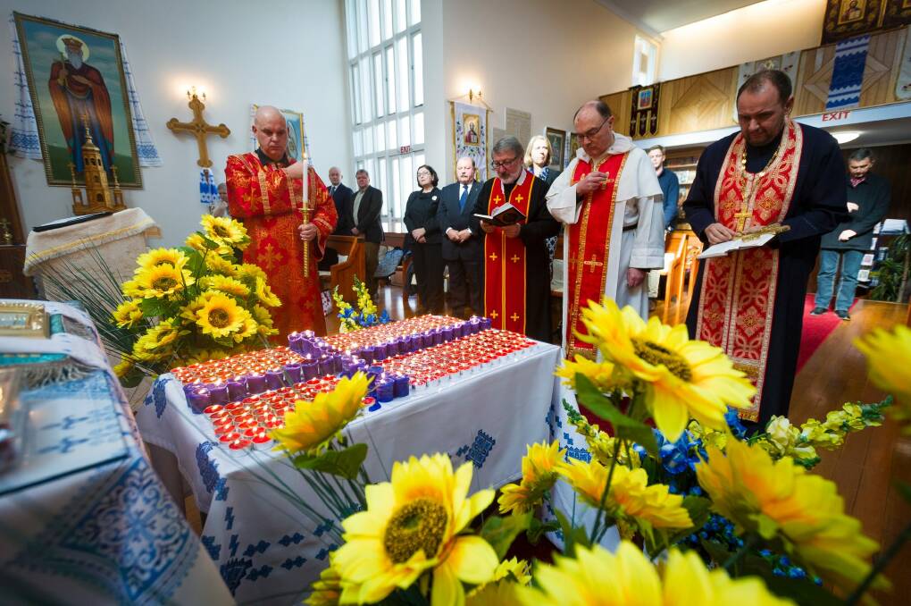 The congregation leading the commemoration for the victims. Photo: Dion Georgopoulos