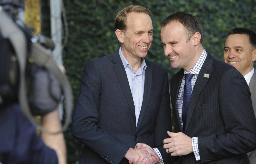 Simon Corbell and Andrew Barr after Mr Corbell's retirement announcement  Photo: Graham Tidy