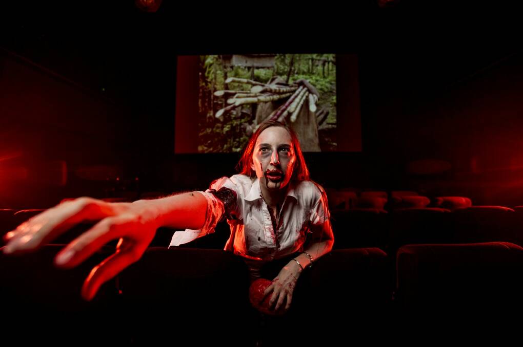 Jae Burns, of the Canberra Zombie Walk, getting in character to spend the scariest night of the year in one of Australia's most haunted buildings, the former Institute of Anatomy, for an all-night movie marathon at the Arc cinema.  Photo: Jay Cronan