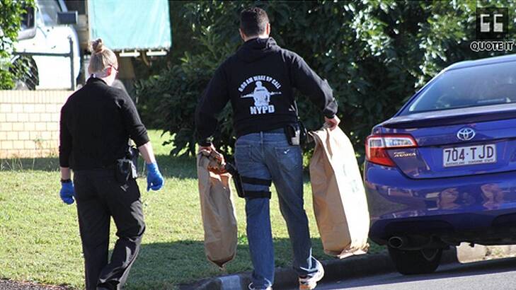 Police seize evidence after a raid in Ormiston on Tuesday morning. Photo: Chris McCormack