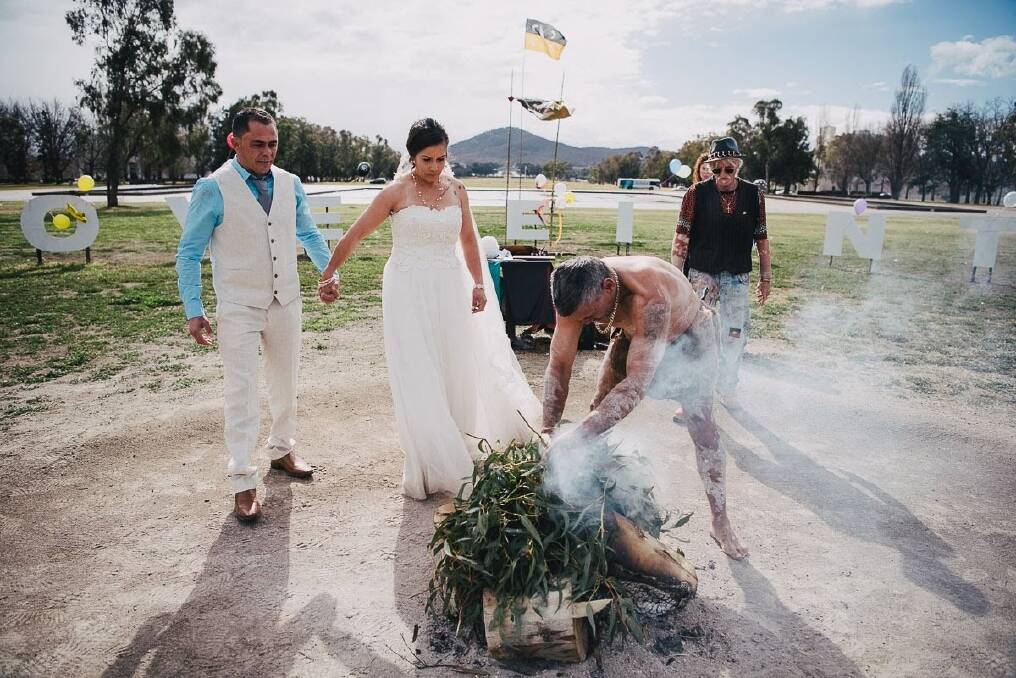 John and Kristie Simpson at their wedding at the Aboriginal Tent Embassy. Photo: Alex Pasquali Photographs