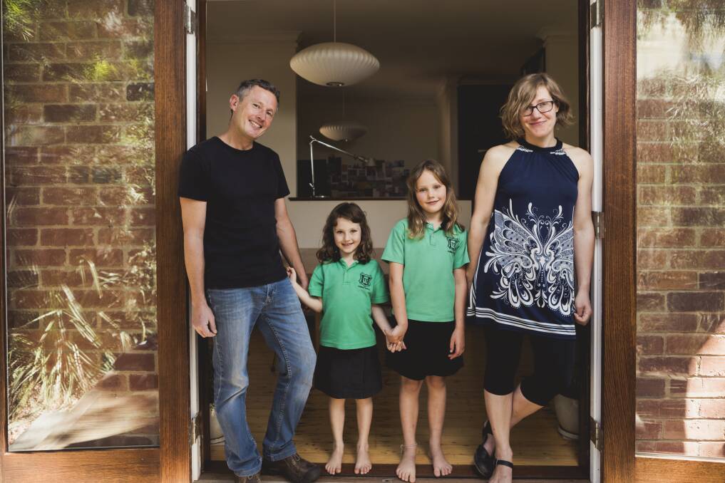 Canberra architect Robbie Gibson has invested into SolarShare, a community run solar farm. Mr Gibson is pictured with his wife Karin Gustavsson, and their children Nelly, 6, and Freya, 9. Photo: Jamila Toderas
