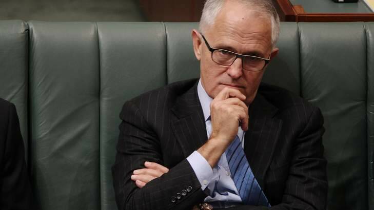 Communications Minister Malcolm Turnbull listens during question time on Thursday. Photo: Alex Ellinghausen