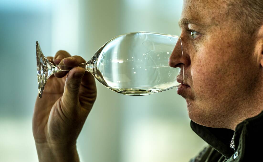 Judge, and local winemaker, Chris Carpenter samples a wine.  Photo: Karleen Minney 